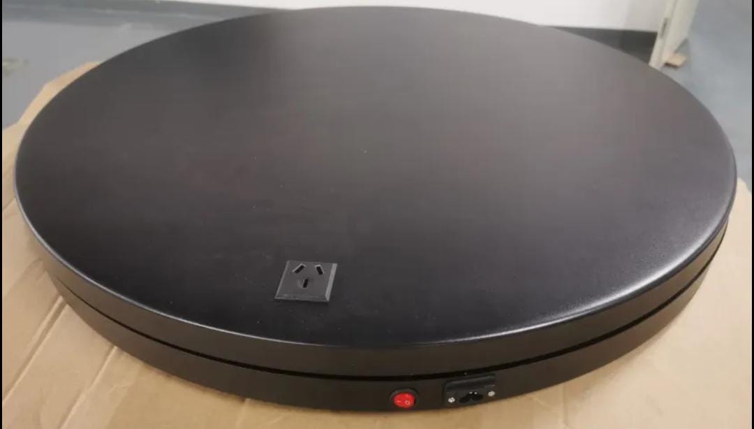 Electric roundtable 80cm diameter, black color with motion sensor and one speaker.